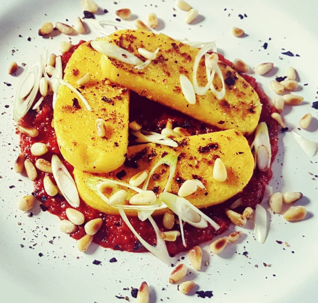 Grilled polenta with spicy tomato sauce and toasted pine&nbsp;nuts