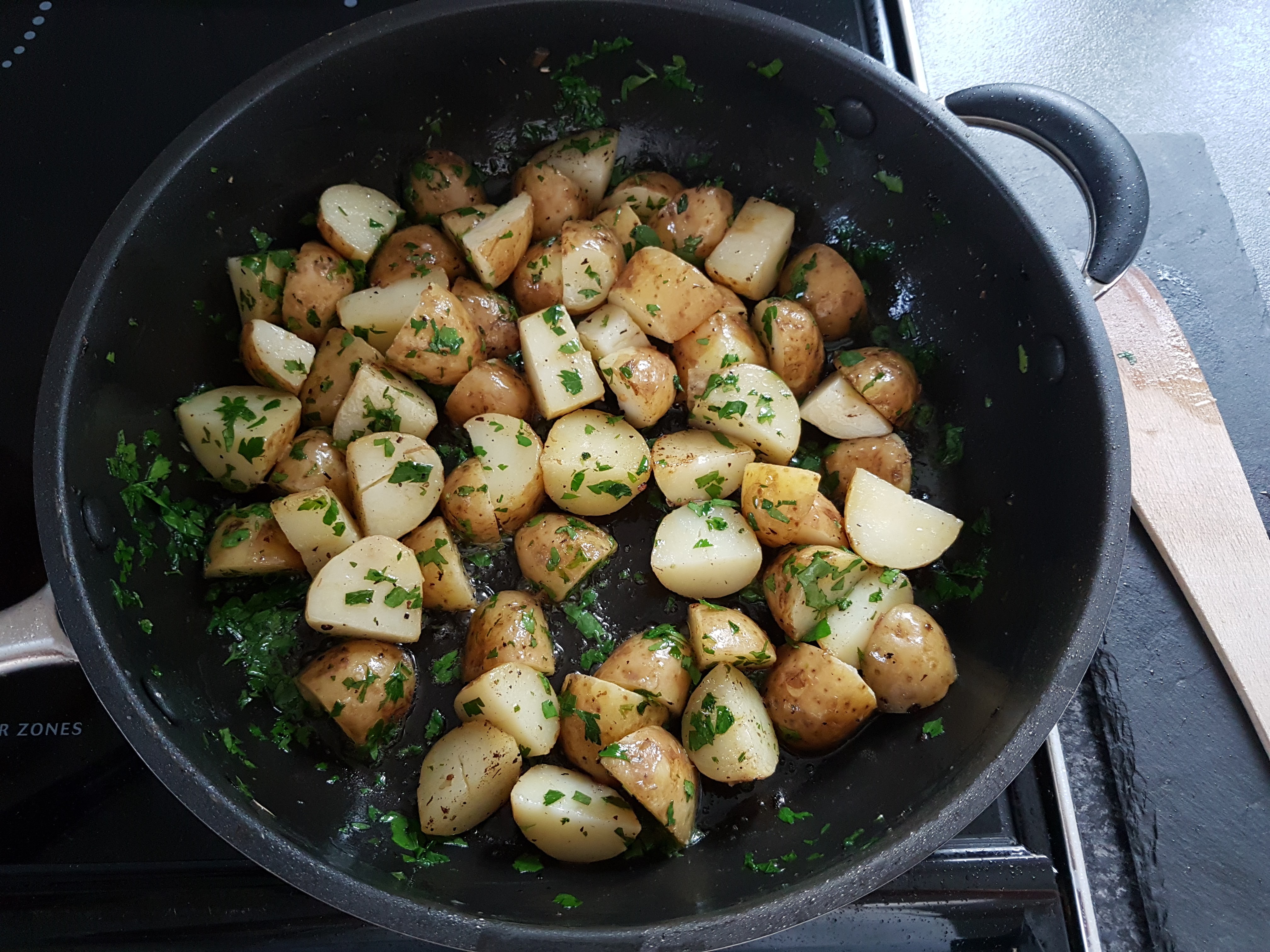 Warm new potatoes tossed with butter and parsley