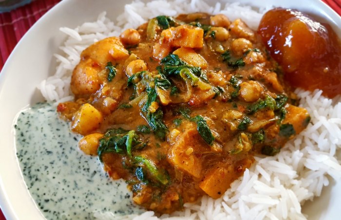 Chickpea, sweet potato and spinach curry served with basmati rice, mint yoghurt and mango chutney
