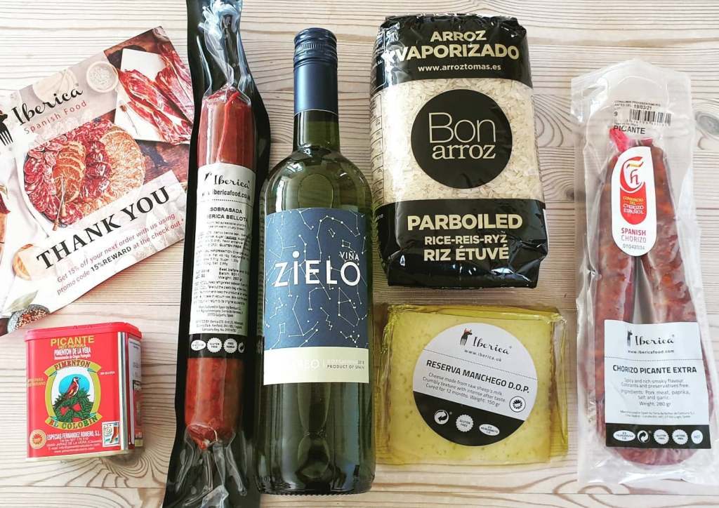 Spanish ingredients from Iberica Food including rice, paprika, chorizo, Manchego and white wine
